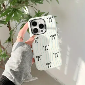 This creamy white and light blue wavy bow-patterned phone case is a durable, shock-absorbing, glossy two-in-one design. It's compatible with iPhone 17, 16, 15, 14, 13, 12, 11, X, and Samsung models. It makes a great holiday gift for friends or family.