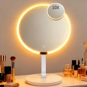 This desktop LED makeup mirror features integrated lighting, adjustable brightness touchscreen, and is portable enough to be handheld. Suitable for home décor, offices, and bedrooms, it also includes a small mirror with 10x magnification.