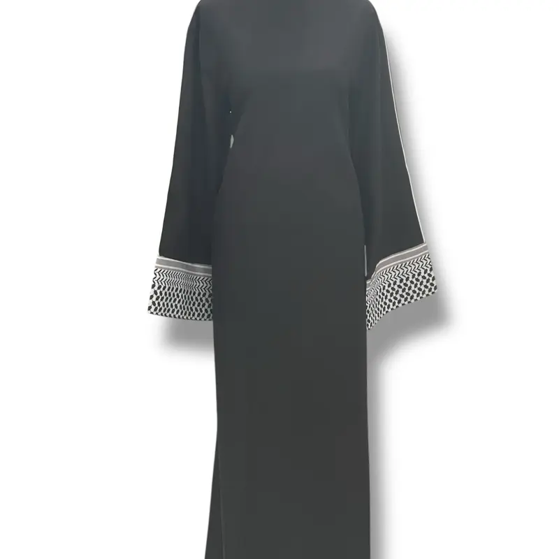 Keffiyeh Abaya Dress- an elegant abaya that has comfort and fashion together. It has a zipper in the back to adjust. Patterns on the Keffiyeh Abaya sleeves symbolize different aspects of Palestinian life. Available in Black and Beige color.