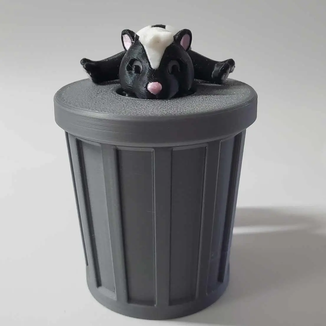 Articulated Skunk in Trash Can – Poseable Skunk Figurine with Removable Lid