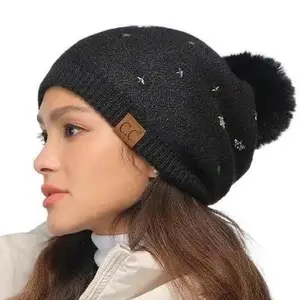 C.C Star Stud Pom Beanie with Pom for Women – Glamorous Winter Hat with Sparkling Star Accents, Cozy and Chic Cold Weather Style casual knit