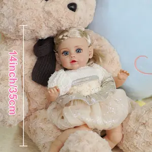 VACOS 14inch Reborn Baby Doll: Golden braided hair, vivid blue eyes, and soft cotton body. Adorned in delicate white lace top with sparkling silver skirt, detailed body creases add lifelike charm. Perfect as a birthday or festival gift!