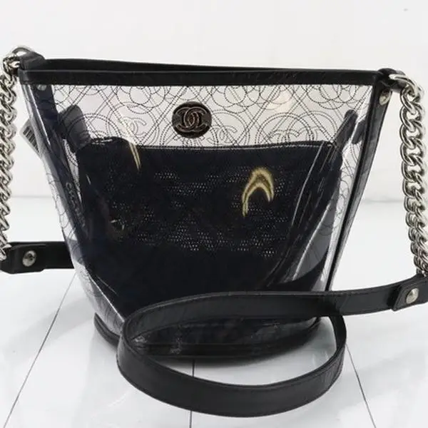 Pre-owned CHANEL PVC and Leather Shoulder Bags Crumpled Calfskin PVC Camellia Bucket Bag Series 25 for Women