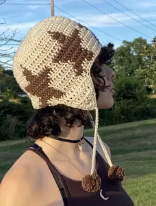 crochet ear flap hat with stars and pompoms, hand knitted hat