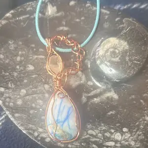 Golden Imperial Topaz and Phoenix Stone Pendant Wrapped in Copper with Blue Cord for Jewelry Enthusiasts