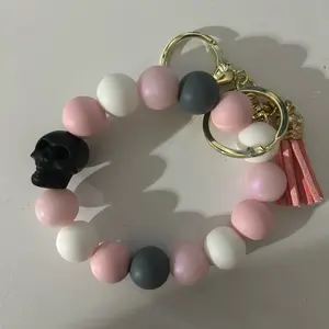 Pink shimmer skull wristlet