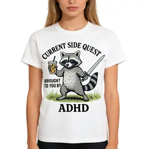Funny ADHD Raccoon Side Quest T-Shirt, "Brought to You by ADHD" Graphic Tee with Coffee & Sword, Humorous Gamer Meme Top, Relatable Neurodivergent Gift, Casual Summer Shirt.