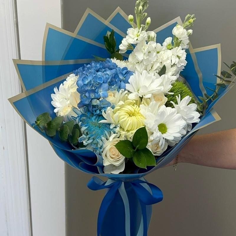 Blue Ocean Bouquet with Blue Hydrangeas White Chrysanthemums and Greenery in Blue Packaging