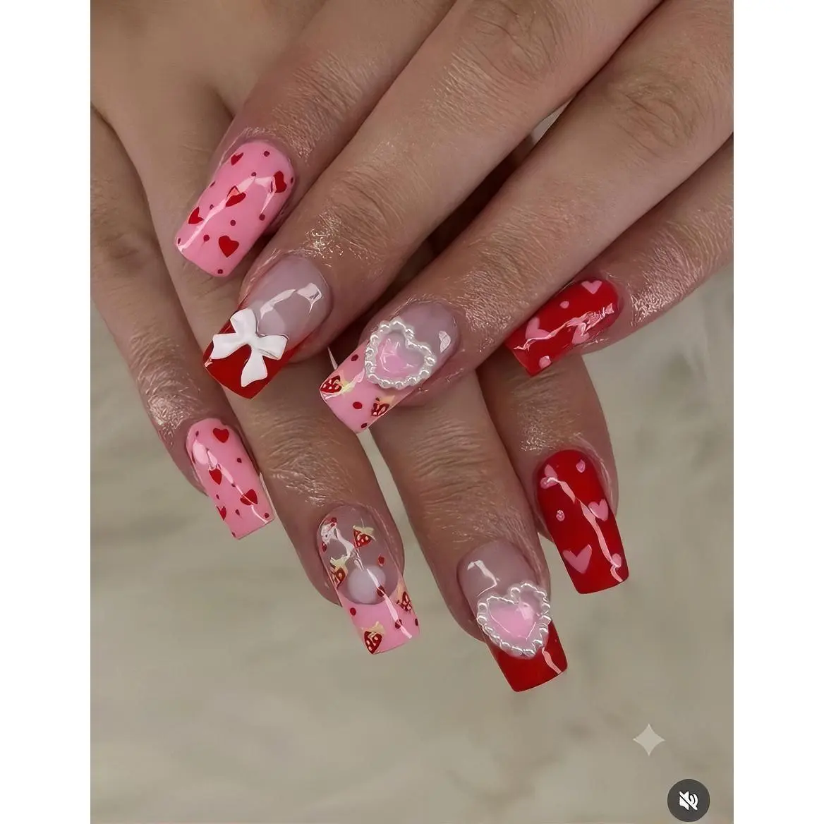 Valentine's Day Nail Art Set with Heart and Bow Designs in Pink and Red Colors for Festive Manicure