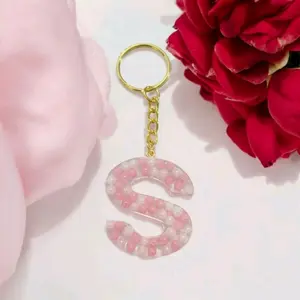 Pink & white beaded letter keychain