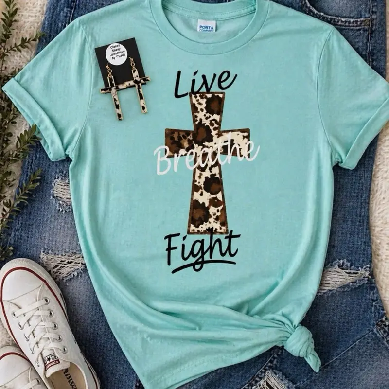 Walk in faith and confidence  “Live • Breathe • Fight” inspirational tee paired perfectly with matching cross earrings  A bold, beautiful reminder to keep going no matter what  Perfect for everyday wear or gifting
