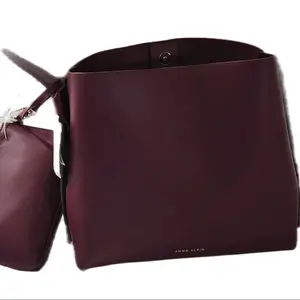 Elegant burgundy Leather Handbag with Secure Lock Closure for Stylish Everyday Use Versatile for Work School or Casual Outings