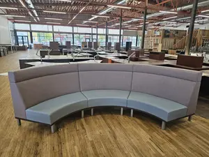 U shaped couch with bar on the back and usb and outlets