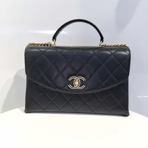 Pre-owned CHANEL Hanel 19K Black and Gold Cutout Trendy CC Series Organ Bag with Quilted Design and Gold Hardware