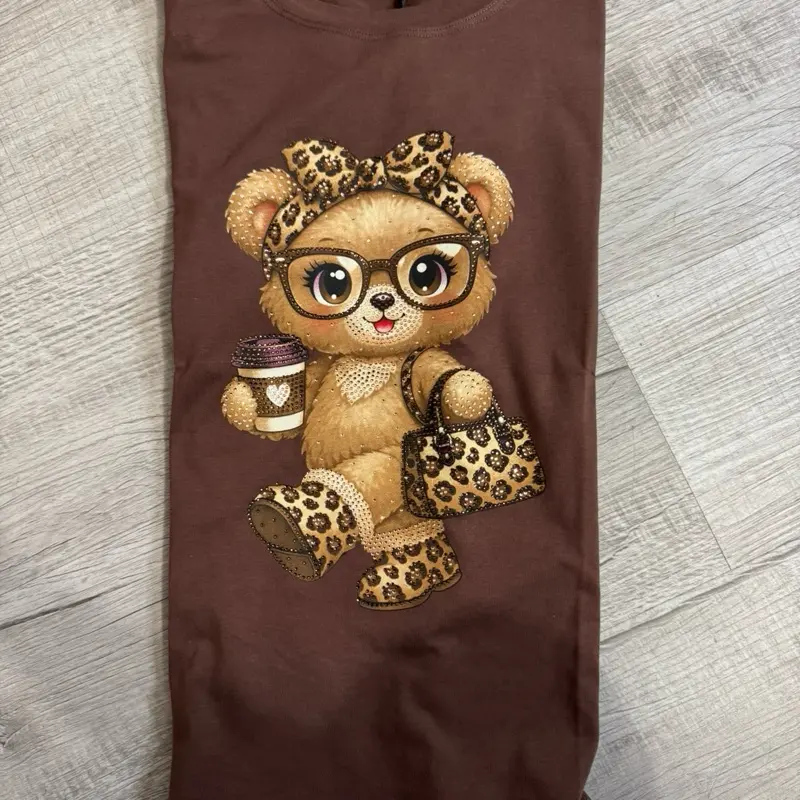 Lucy Top -Meet your new everyday statement tee. this relaxed-fit graphic t-shirt features an adorable luxe teddy bear print with chic leopard accents for the pertect cute-meets-baddie vibe. designed with a comfy oversized silhouette that pairs ettortlessl