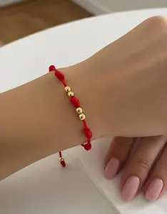Adjustable Red String Bracelet with Bead and Knot Details