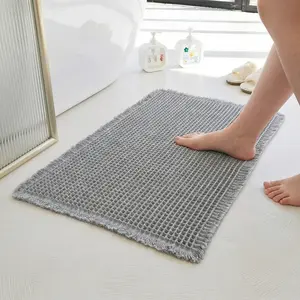 Upgraded waffle bath mat, super absorbent non-slip bath mat, backing bathroom mat. The backing is made of rubber to prevent slipping. This bathroom carpet can be machine washed and comes with decorative tassels. door mat rug soft kitchen Pattern room tikt