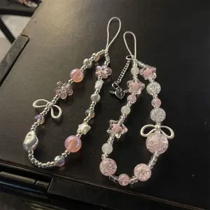 ins style sweet and cool light luxury girl pink flower burst beads alloy bow tie mobile phone chain phone case accessory ccd camera chain bead string Phone Strap
