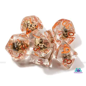 Olmec's Temple | Golden Metal Skull Charm Inside, Orange Ink | Clear Resin Dice Set (7)