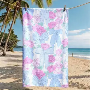 A Pink and Blue Bow Floral Printed Beach Towel, Oversized, Skin-friendly, Absorbent, Quick-drying, Quick Drying Towels, Perfect for beach, pool, summer trips, and outdoor picnics, Reusable Polyester Towel
