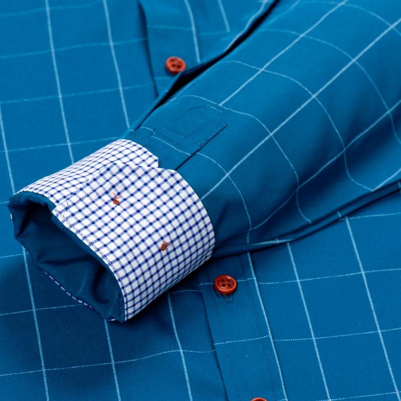 Men’s long-sleeve shirt with four plaid color-block panels, business-casual style. Button-down notched collar design for a sharp look, red buttons add refined details, blue-and-white plaid interior provides visual depth. Long-sleeve fit suitable for multi