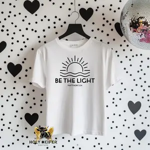 Faith Based + Tee - White Top with "BE THE LIGHT" Graphic and "Matthew 5:14" Text, Short Sleeve, Womenswear