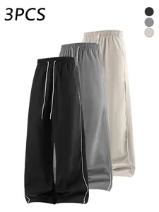 3-pack men’s casual athletic pants with side stripes, adjustable drawstring elastic waistband, loose straight-leg fit