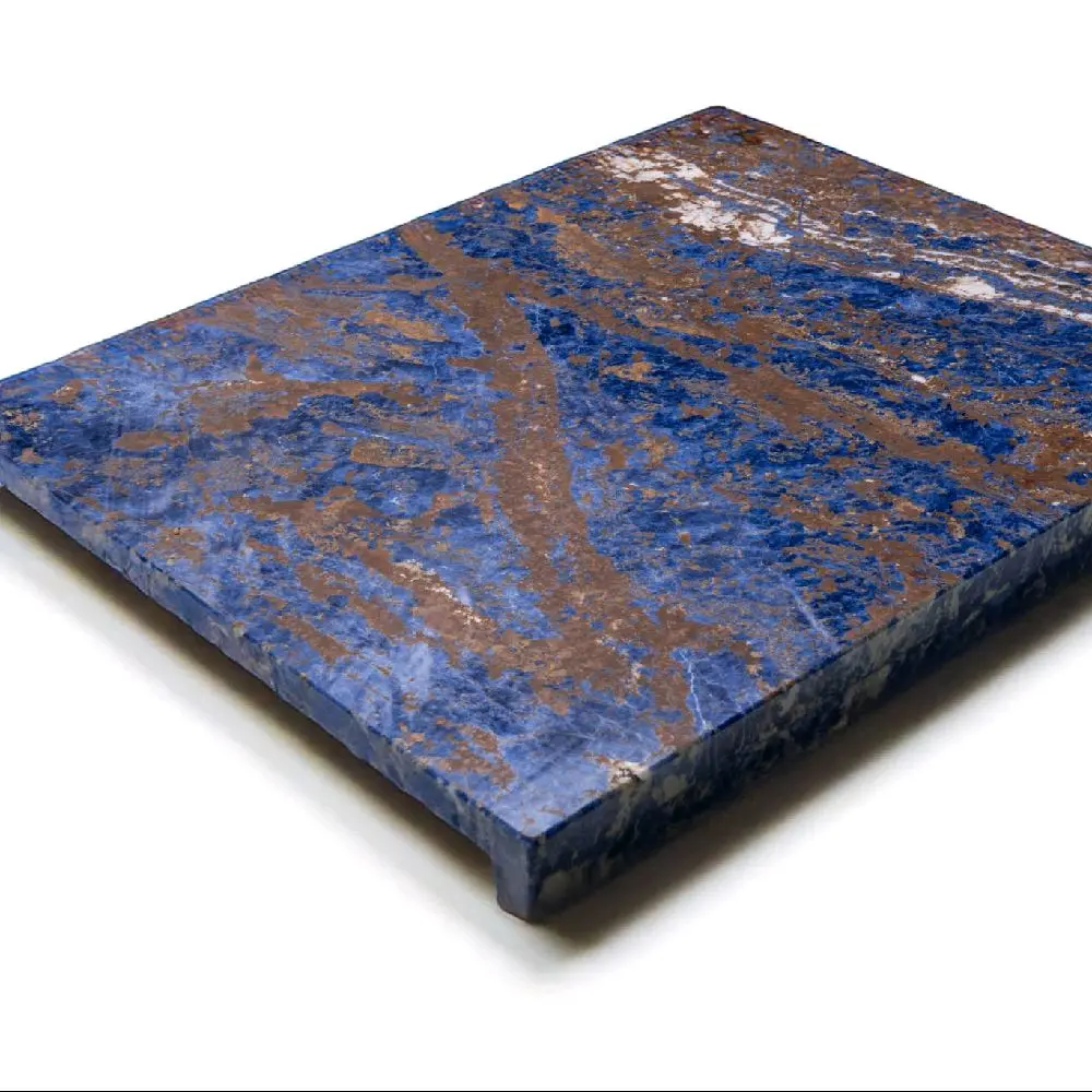 Italian luxury craftsmanship.  It's made from semi-precious blue sodalite stone sourced from Brazil.  Celebrated for its deep blue hues and striking natural patterns, this unique board offers both beauty and function.  Perfect for pastry preparation.