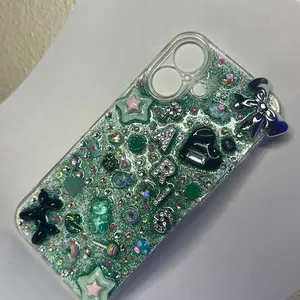 iPhone 16 Junk Case with Glittery Green Design and Decorative Charms for Stylish Protection