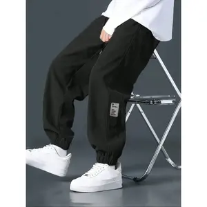 Men's Solid-colored Corduroy Pants with Loose-fit & Cuffed Design, Featuring A Side Patch on The Leg and An Elastic Waist with Drawstring for Adjustable Fit. Vintage Workwear Style, Versatile for Various Occasions—classic Men's Black Cuffed Long Pants