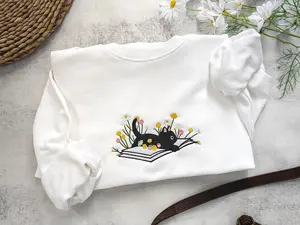 Embroidered Cute Black Cat Sweatshirt, Cat Lying On Book Sweater, Cat Flower Daisy Crewneck Sweatshirt, Embroidered Cat Reading Book T-Shirt, Cat Flower Embroidered Tee Shirt, Embroidered Cat Lover T-Shirt, Best Gift For Cat Lover