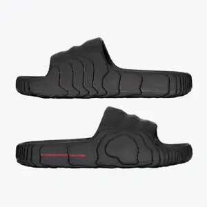 Adidas Adilette 22 Slides ID4925 – Modern minimalist slip-on sandals featuring lightweight molded EVA construction, futuristic wave-inspired design, soft cushioning comfort, durable one-piece build, quick-dry material, ideal for pool, beach