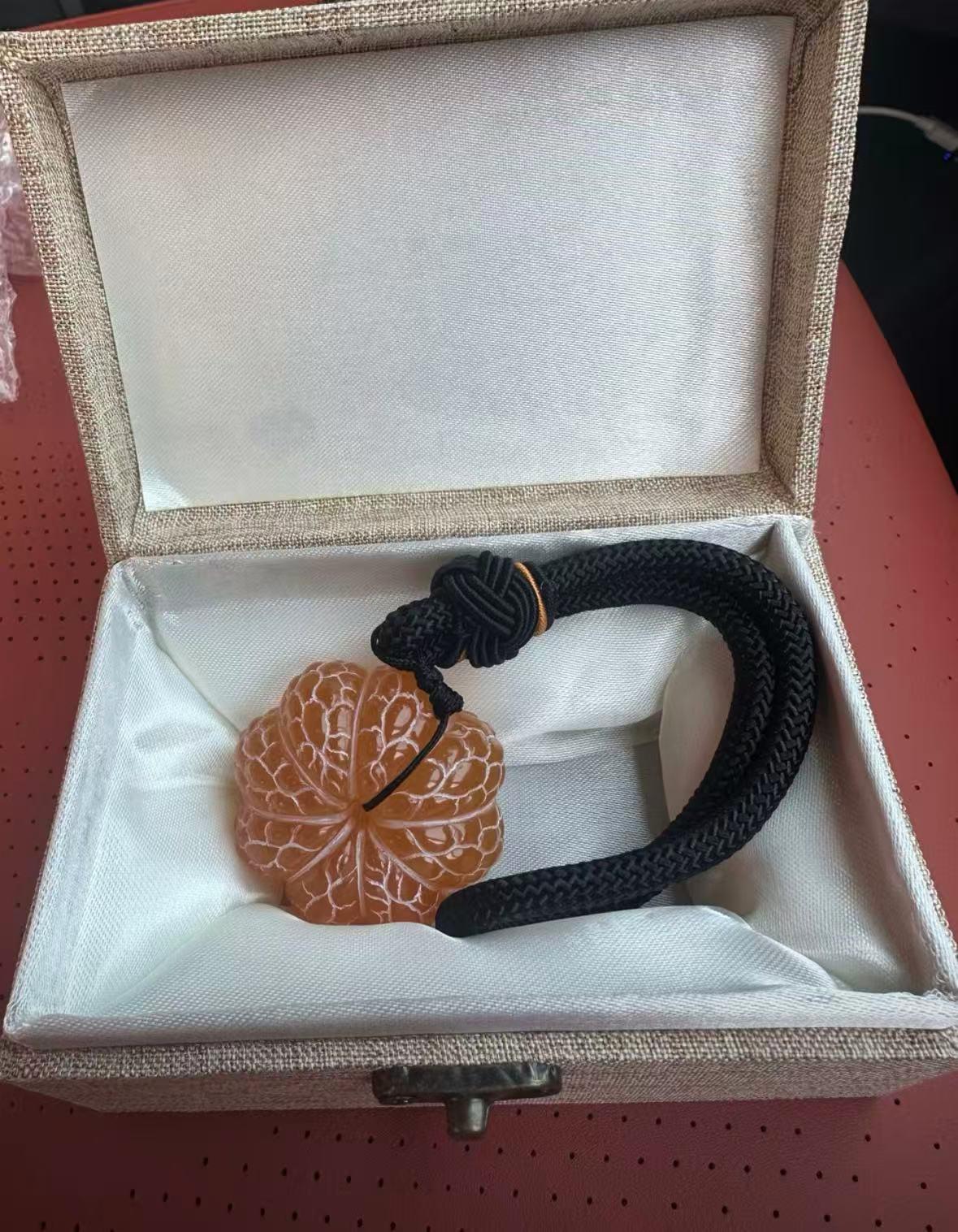 Oriental Gold Frozen Stone ornament, handheld piece, spinning craft item, souvenir gift, stress-relief spinning, hanging decoration, orange ornament