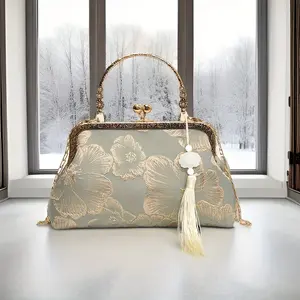 A Patterned Evening Clutch with a Buckle Closure, a Trendy and  Dinner Bag, a Simple and Casual Small Handbag. Suitable for Special Occasions, This Fabric Women's Shoulder Chain Bag Features a Polyester Lining - a Versatile Qipao-inspired Messenger