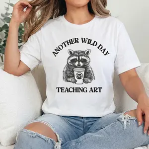 Womens "TEACHING ART" Graphic T-Shirt, Funny Raccoon Coffee Cup Shape Tee, Retro Slogan Printed Top, Casual Soft Fabric Back To School Classroom Instructor Apparel