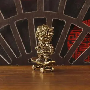 Brass Skateboard Monkey Decorative Statue, Unique Home Décor Item, Perfect for Gift Giving, Durable Brass Material, Eye-Catching Design