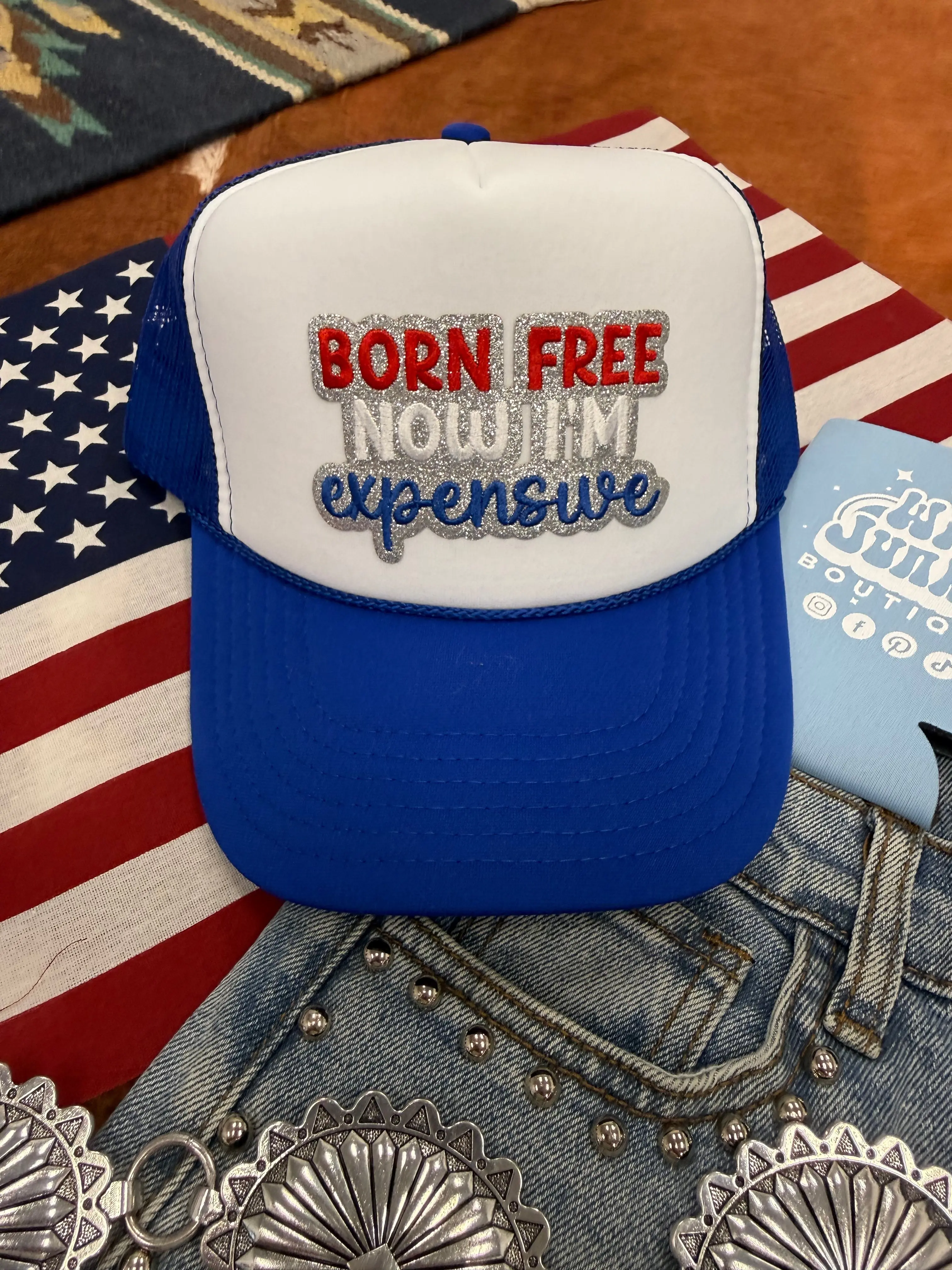 Wild Junkie Born Free Now I'm Expensive Graphic Trucker Hat, Casual Baseball Cap with Mesh Panel, 1 Size Fashion Accessory, One Size