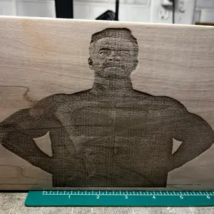 Omni-man engraved on wood