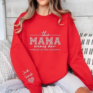 Custom Mama Sweatshirt With Kids Names On Sleeve, This Mama Wears Her Heart On Her Sleeve, Mom Christmas Crewneck Sweater, Mothers Day Gift for Mom