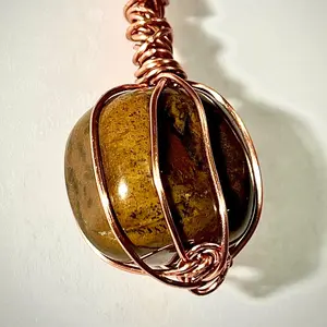 Tigers Eye Crystal Pendant wrapped in pure copper wire, on rose gold plated copper necklace.