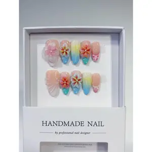 Handcrafted wearable nails with delicate, floral-inspired carvings and a gradient design-luxuriously understated, soft and flattering to the skin, and removable.