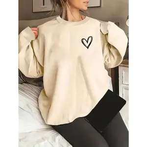 Women’s casual oversized crew-neck sweatshirt with a subtle heart print, made from soft beige 100% polyester knit fabric—a cozy and stylish pullover for spring and fall.