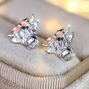 A pair of exquisite imitation silver hypoallergenic bull shaped earrings - a unique female personalized jewelry, nickel free, lead-free, durable, and comfortable to wear - the perfect ear decoration for fashionable women's multifunctional fashion jewelry