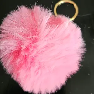 Light pink puffed ball keychain.