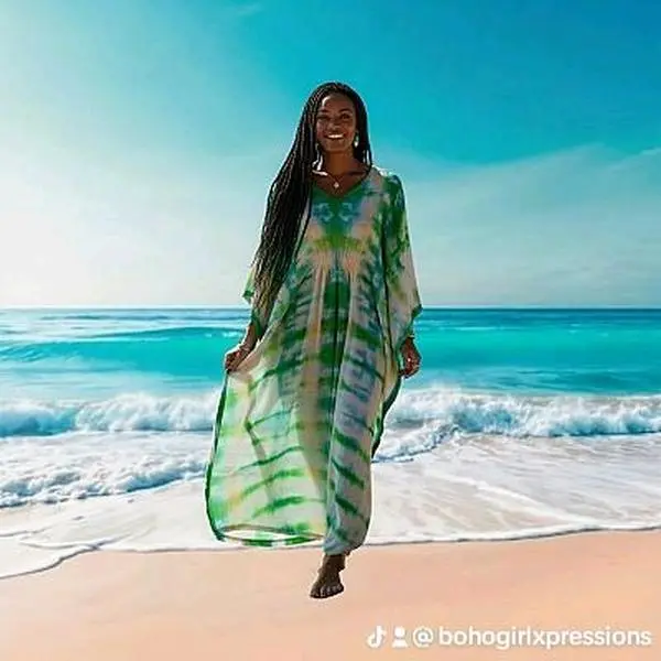 Island Breeze Hand-Dyed Caftan  Bring the calm beauty of the ocean to your wardrobe with this lightweight, hand-dyed caftan. Its flowing fit and vibrant green design make it perfect for