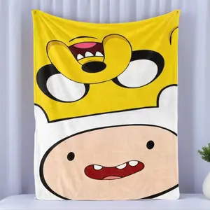 Adventure Time Finn & Jake Close-Up Flannel Fleece Blanket – Bold yellow and white split backdrop with playful, oversized faces of Finn and Jake, capturing the silly charm of the animated series, perfect for cozy cartoon marathons and fans