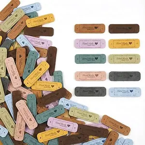 100PCS Handmade Tags for Crochet Handmade Leather Labels Faux Handmades with Love Leather Tags for Handmades Items Embellishment Knit Accessories with Hole for DIY Crafts Sewing Crochet Knitting Hats