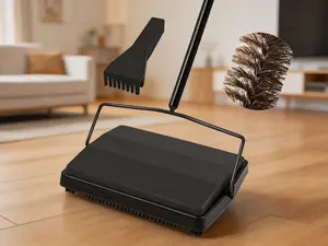 Manual floor sweeper with premium horsehair bristles. Non-electric and quiet push-style roller brush, effortlessly cleaning pet hair, lint and loose debris from carpets and rugs. Sleek black design, simple to operate for daily household cleaning.