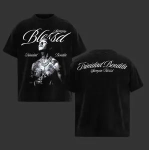 Blessd Trinidad Bonita T-shirt – oversized black Latin streetwear shirt with front prayer pose artwork and back stylized “Siempre Blessd” script – unisex fit for reggaeton fashion and limited drop collections