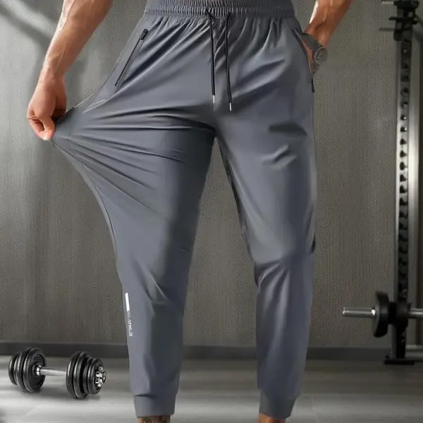 Men's Loose Letter Print Quick-Dry Jogger Pants - Soft Stretchable Solid Color Trousers with Elastic Adjustable Drawstring Waist, Pleated Active Pants for Daily Lounge & Light Gym Work